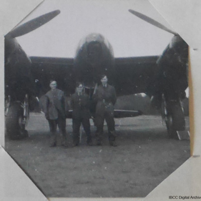 Three airmen in front of a Mosquito